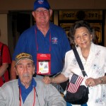 Villager Michael Rossi with his wife Marie and Villages Honor Flight Guardian John Bartelink.