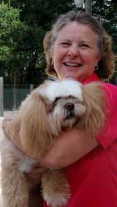 Becky Williams of Village Pet Spa cuddles with one of the guests.
