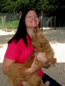 Katie Wallace of Village Pet Spa gets a kiss from one of the guests.