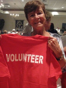 Bea Rowe of the Claddagh Irish American Club shows off her volunteer shirt for the Italian American Parade set for Oct. 8.