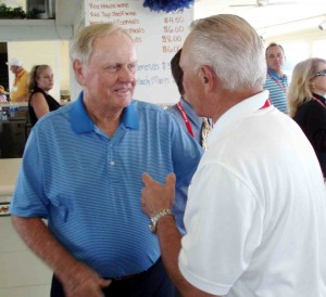 Jack Nicklaus chats with Bill Heron, a PGA professional who teaches at the Villages Golf Academy .