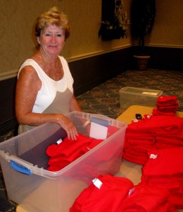 Joan Hagemeyer sorts through parade volunteer shirts