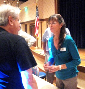 CDD 6 Chair Sally Moss listens to a resident at Monday's "State of the District" meeting.