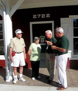 Tony and Joan Stoll of the Village of Alhambra visit with Ed Kelly and Steve Renico of Seniors vs. Crime at the new Brownwood Paddock Square office. 
