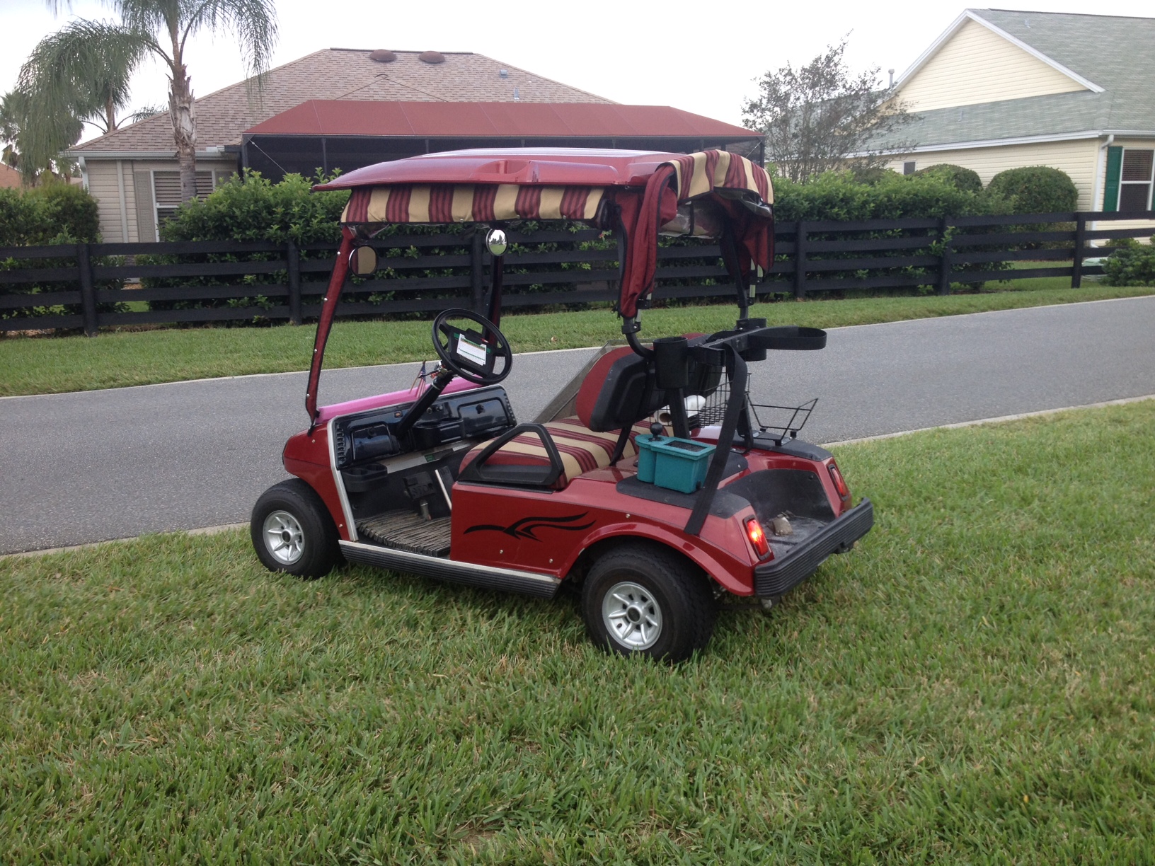Red golf cart involved in accident, abandoned near Savannah Center cart path