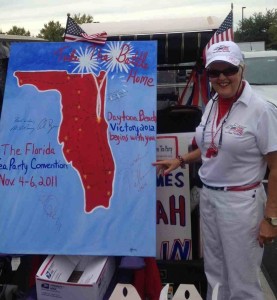 Aileen Milton of the Villages Tea Party shows off a poster signed today by Sarah Palin who was making an appearance in The VIllages.