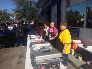 Church members Cathy Brunner (right), and Cathy Pennypacker help serve the community