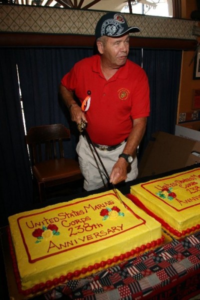 Don Westlake - current Commandant, cutting cake. Photo courtesy of Tom Ciesla