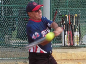 Softball’s R Game manager Ray Pinheiro connects for a hit.