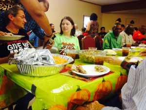 Youth Challenge members and their families enjoy an early Thanksgiving lunch