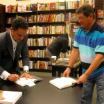 Cliff Lunn has Brian Kilmeade autograph his two books.