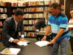 Cliff Lunn has Brian Kilmeade autograph his two books.