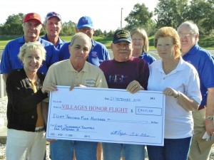 Fran Pryor, Steve Pryor, Glenn Allen, Angie Allen, in front from left, and Jerry Lemerise, Mike Parker, Bob Bauer, Penney White, and John Driscoll, back row from left, were on hand for the check passing Friday.