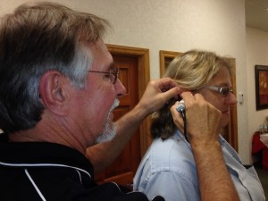 Bill Broome (left) demonstrates the video Otoscope on Terri Friesner of Better Space! Storage