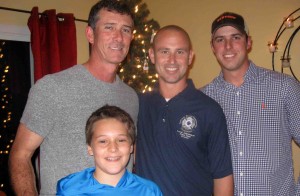 Mark Panigoni , left, with his son Jack, and Lt. Bradley Mattingly, center, and Mike Sapp of Villages Public Safety.