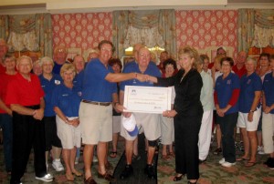 Cindy Nazzaro of Parady FInancial Group presents a $6,000 check to Villages Honor Flight.