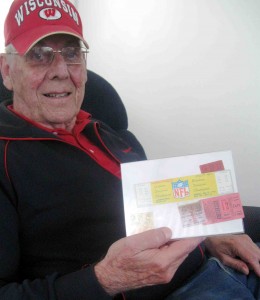 Villager Sox Jung shows off Green Bay Packers' tickets, including his 1967 Ice Bowl ticket. 