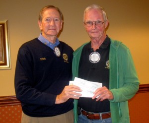 Richard Phoebus (left), president of the Rotary Club of The Villages, presents a check to Richard Cambell of The Villages Regional Hospital Auxiliary Foundation.
