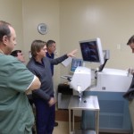Jeffrey D. Baumann, M.D. (center) demonstrating the Lensx Femto Laser