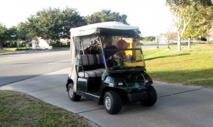 A golf cart driver safely enters the golf cart path after exiting Morse Boulevard.