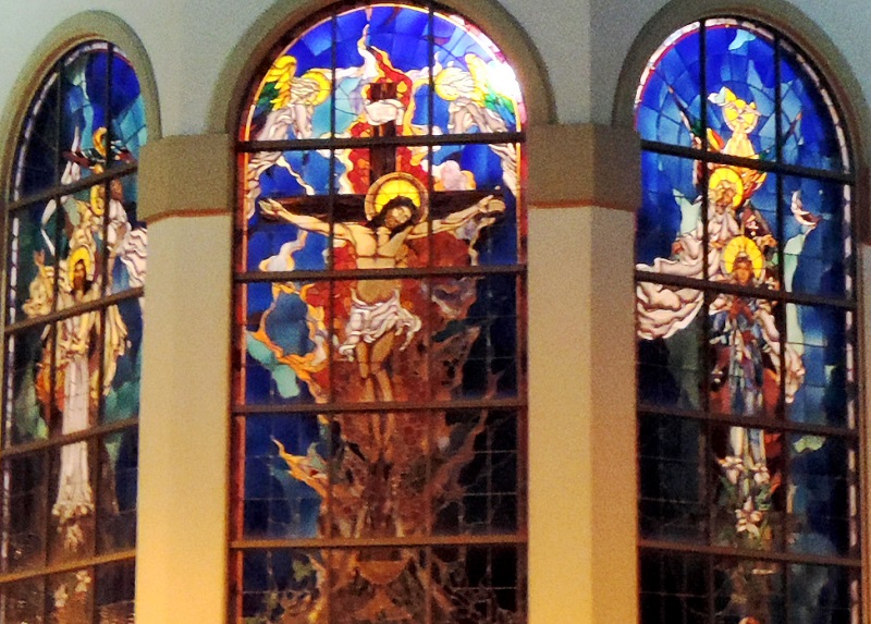 Where in The Villages are these stained-glass windows located? 