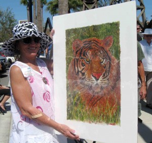 Billie Edwards shows off a piece of her artwork Sunday. She was the winner in Sunday's VAA show.
