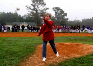 Mayor Ruth Kussard throws out the first pitch at the opening day of Lady Lake Little League.