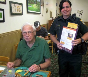 Diner Tom Barbera, who is visiting The Villages from Wisconsin, with Deputy Beatrice Ayala who served as his waitress.