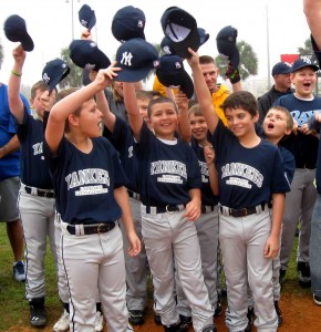 The Yankees raise their hats and cheer as they are introduced.