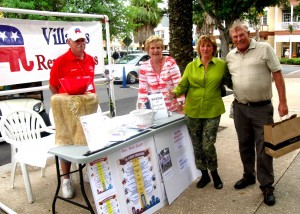 Walter and Marie Lazinski, left, greet Greg and Diane Gardner at the Republican table at Market Night at Lake Sumter Landing.
