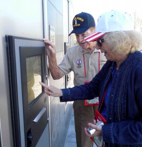 Myron Guisewite and Diana Bernard use a computer to find his name at the Air Force Memorial.
