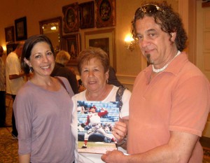 Sharon and Vinni Verhagen with Tony Lupica, from left, at Saturday's autograph signing at Savannah Center.