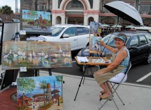 Diana Crow displays her artwork Sunday.