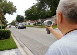 Carl Kusky uses radar gun to check the speed of a vehicle driving down Chula Vista Avenue.