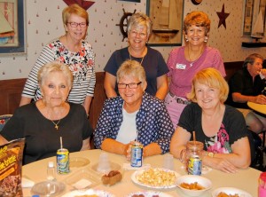 Six Villages friends had a fun time at the auction. Flanking a table full of finger foods were Village of Fernandina residents Barbara Lovett, Barbara Segrich and Florence Bittle (standing) and Village of Bonita neighbors Mary Zappone, Maryann McGowan and Marge Grachocki (seated).