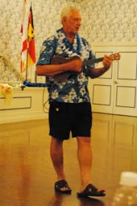 DJ Ron the Man, also known as Villager Ron Gustaitis, played his ukelele and led the Deutscher Club in comedic activities during their Hawaiian Luau night.