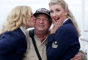 Irving Locker gets a kiss from two of the "Candy Girls" at the 70th anniversary D-Day observation.