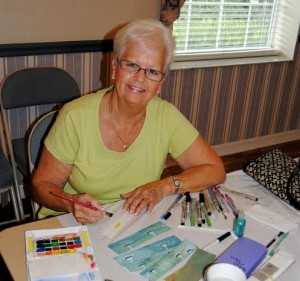 Artist Diane Weekley painted tranquil sailboat scenes on re-purposed canvas strips.