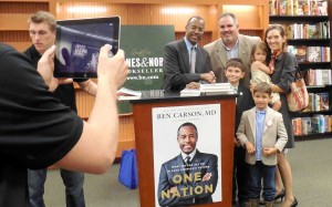Marion County Commission Chairman Carl Zalak and his family are photographed with Ben Carson.