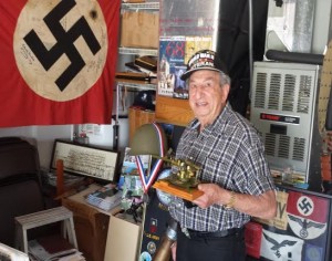 Irving Locker at home with some of  his memorabilia from World War II. 