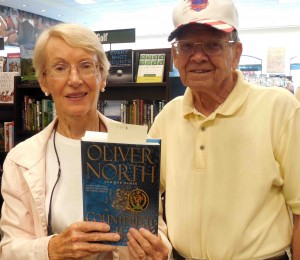 Keith and Bev Llewellyn of the Village of Virginia Trace show off their copy of Oliver North's latest book.