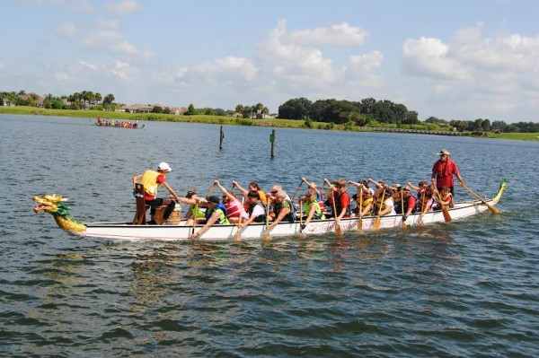 Camp Villagers take to Lake Sumter in a Dragon Boat. 