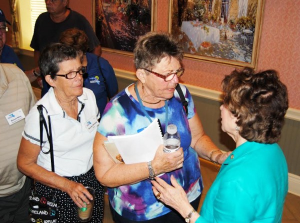Members of the Villages Democratic Club talk to Nan Rich at Colony Cottage Recreation Center.