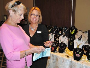 ​ Sabal Chase Villager Mabe Fink shopped for hand-made jewelry at Janet Stewart's display.