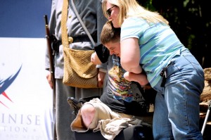 Marine Sgt. John Peck gets a hug from his mother, Lisa.