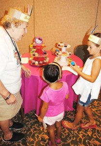 Volunteer Grace Frazzetta had the best job -- handing out the tiny cupcakes. 