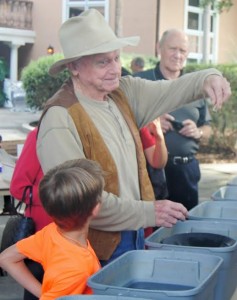 Gary Carr teaches Camp Villagers about panning for gold.