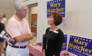 Villager Bob Janson chats with judge candidate Mary Hatcher. 