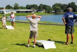 Judy and Glenn Perkins engaged grandsons, Matt 7, and Will Sutton, 10, in a corn hole toss game.