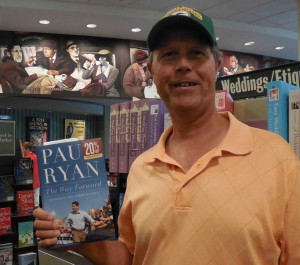 Damian Neumann of the Village of Lake Deaton with Paul Ryan's book.